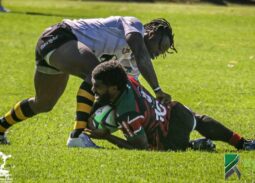 Kenya Simbas Jone Kubu brought down by a Zimbabwean Opponent. Photo Courtesy/ Kyros Sports