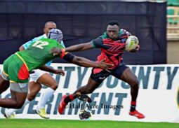 Kenya Simbas Brian Tanga paces past a senegalese opponent. Photo/Denis Acre-half
